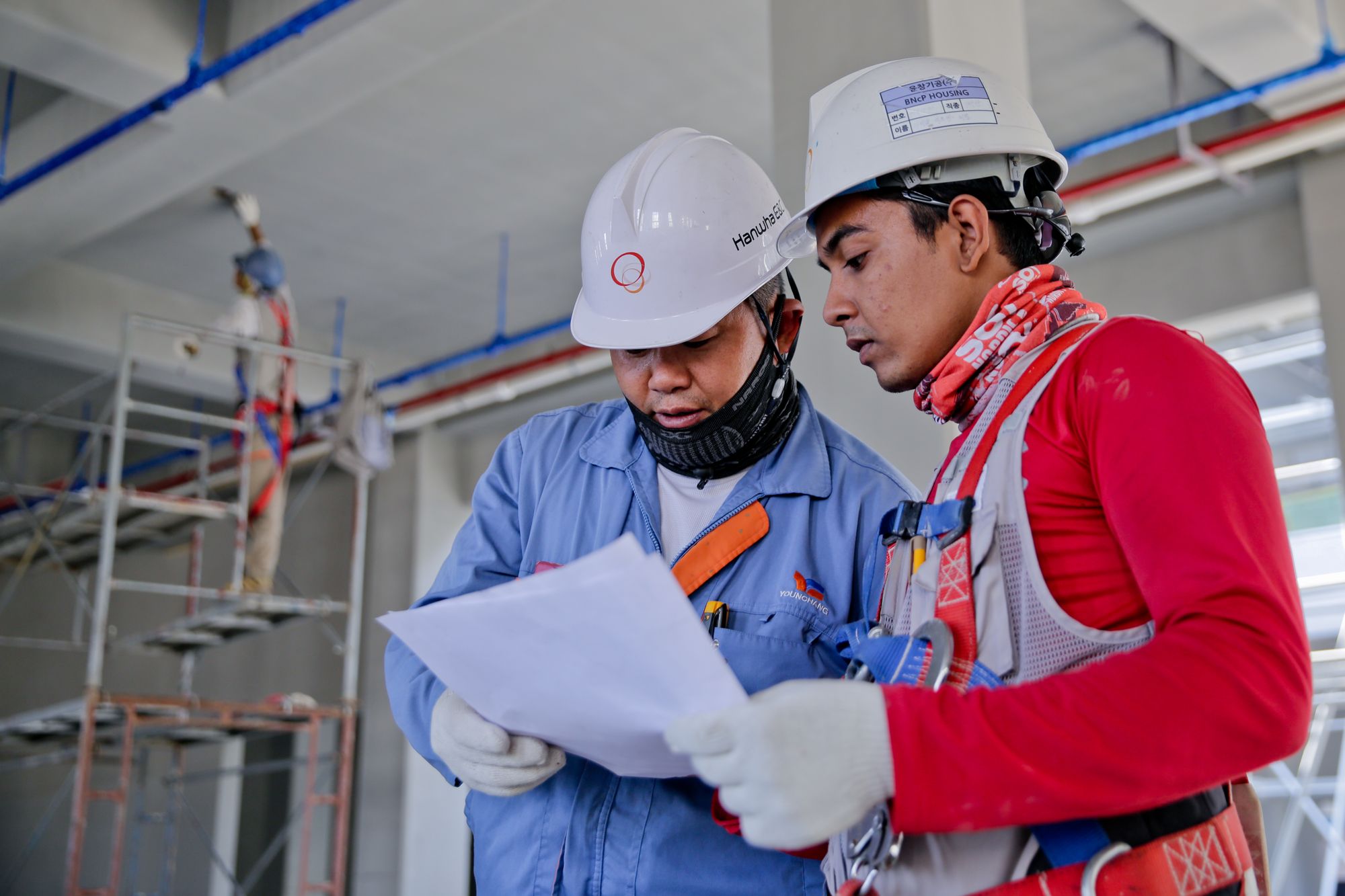 Jadan Construction crew reviewing plans on site